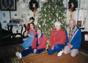 Members of the Fuller family in front of Christmas tree at Rose Hill, December 1998, 2021.P.FIC.287a